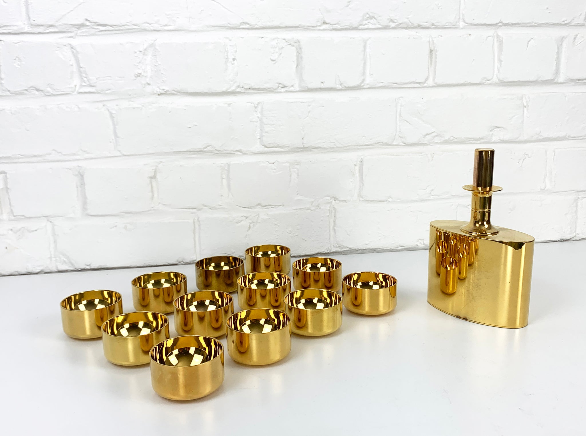 Decanter & 12 bowls in gold plated brass, Pierre Forsell for Skultuna, 1960s