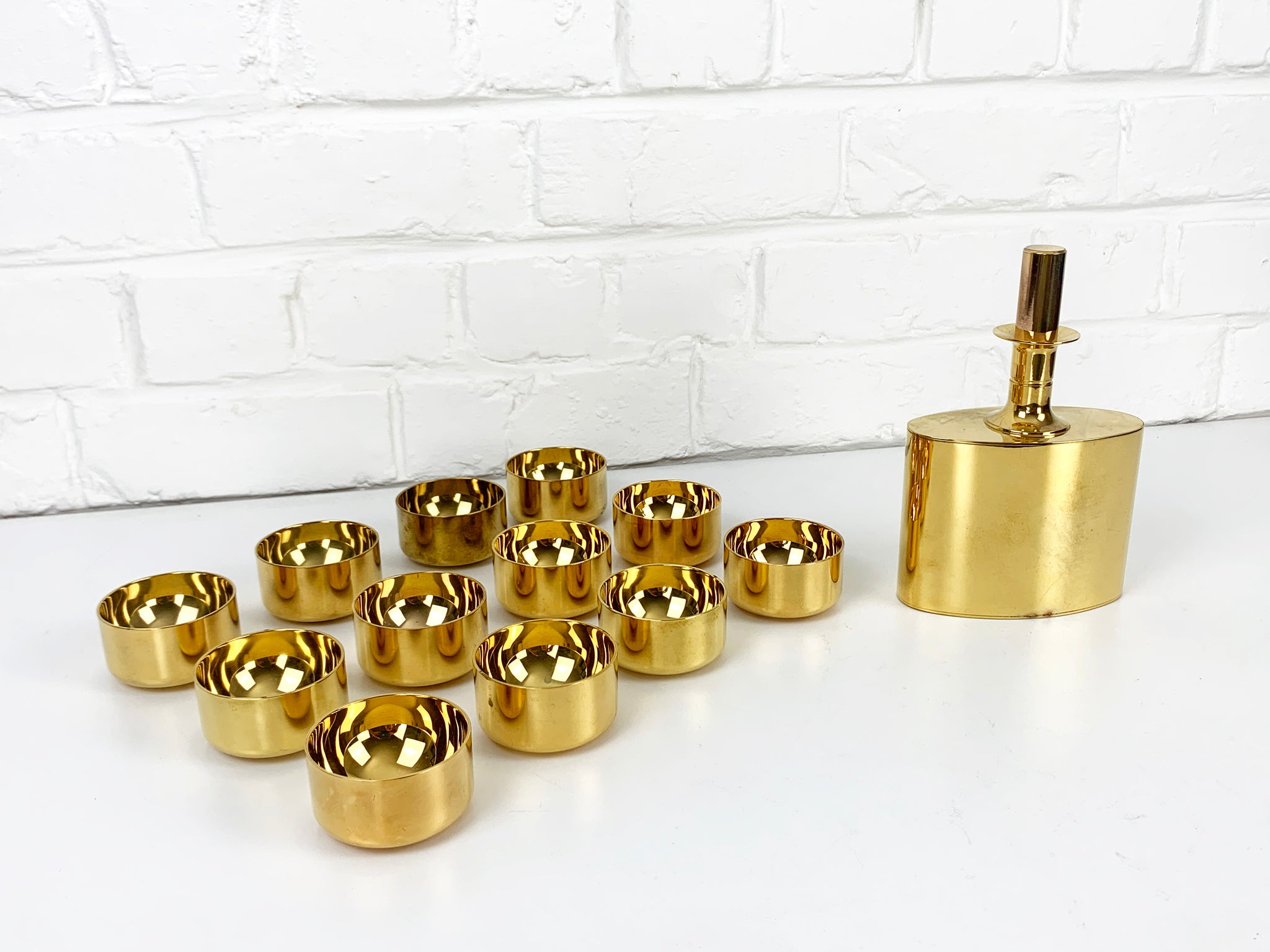 Decanter & 12 bowls in gold plated brass, Pierre Forsell for Skultuna, 1960s