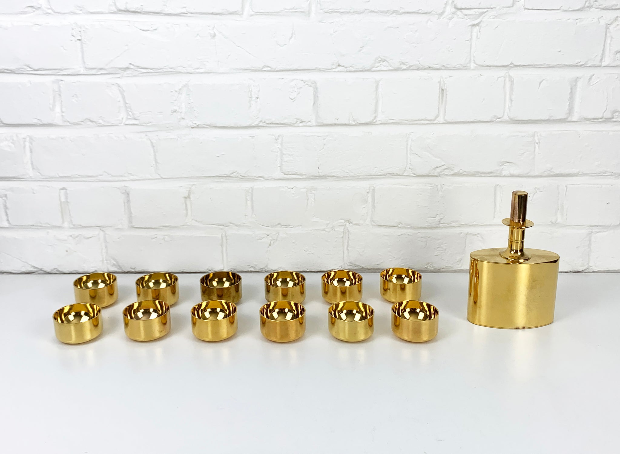 Decanter & 12 bowls in gold plated brass, Pierre Forsell for Skultuna, 1960s