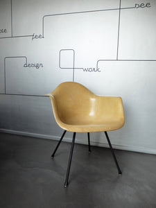 LAX armchair by Charles and Ray Eames in ocher colour