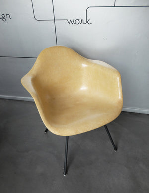 LAX armchair by Charles and Ray Eames in ocher colour