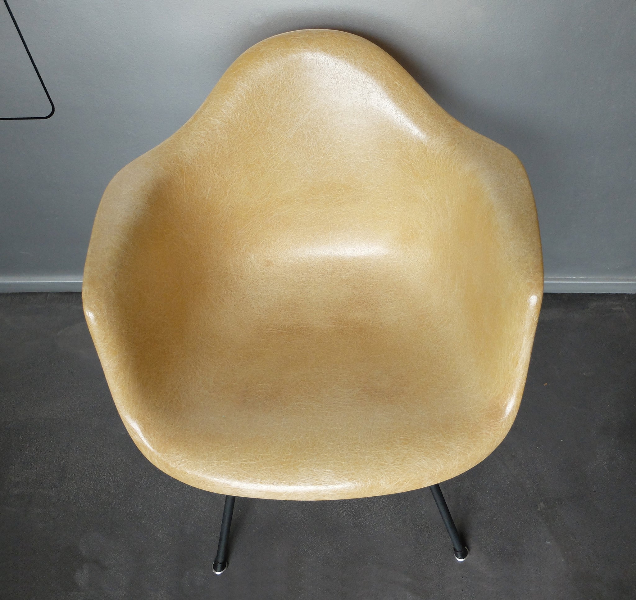 LAX armchair by Charles and Ray Eames in ocher colour