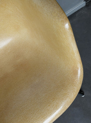 LAX armchair by Charles and Ray Eames in ocher colour