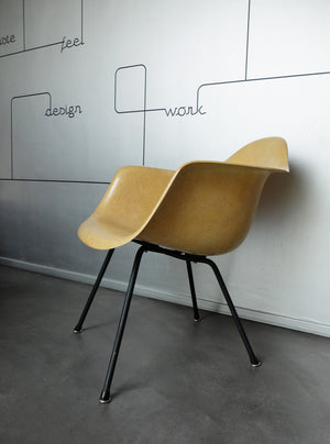 LAX armchair by Charles and Ray Eames in ocher colour