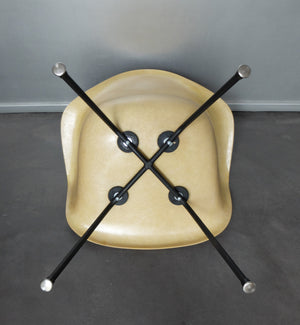 LAX armchair by Charles and Ray Eames in ocher colour