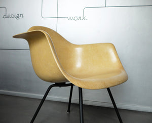 LAX armchair by Charles and Ray Eames in ocher colour